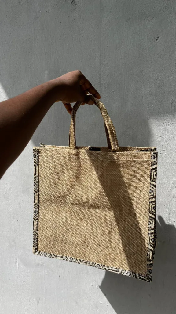 Small branded jute tote bag, commonly used as a durable souvenir or gift bag in Nigeria