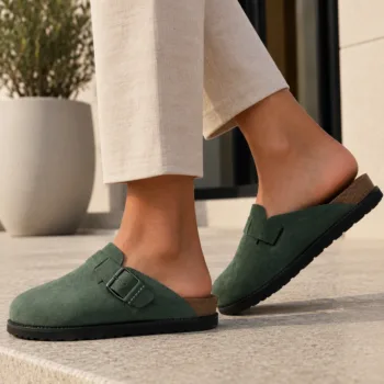 A person wearing handmade clog mules