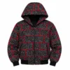 Woman wearing a black and red Ankara African print cropped zip-up hoodie jacket with hood and long sleeves.