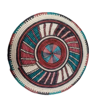 Round handwoven rattan placemat with colourful concentric woven pattern