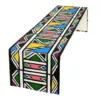 Ndebele table runner with colourful geometric African print on faux linen
