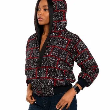Woman wearing a black and red Ankara African print cropped zip-up hoodie jacket with hood and long sleeves.