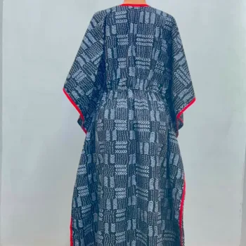 Women's African print kaftan in black and white geometric pattern with red trim, V-neckline and adjustable waist