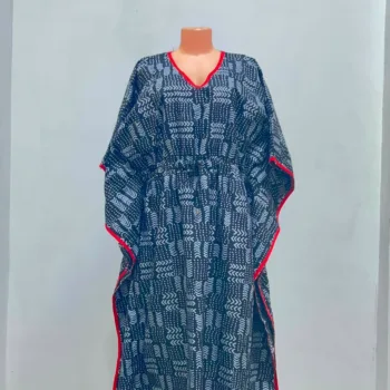Women's African print kaftan in black and white geometric pattern with red trim, V-neckline and adjustable waist