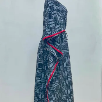 Women's African print kaftan in black and white geometric pattern with red trim, V-neckline and adjustable waist