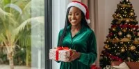 A young Nigerian lady holding a Christmas gift box